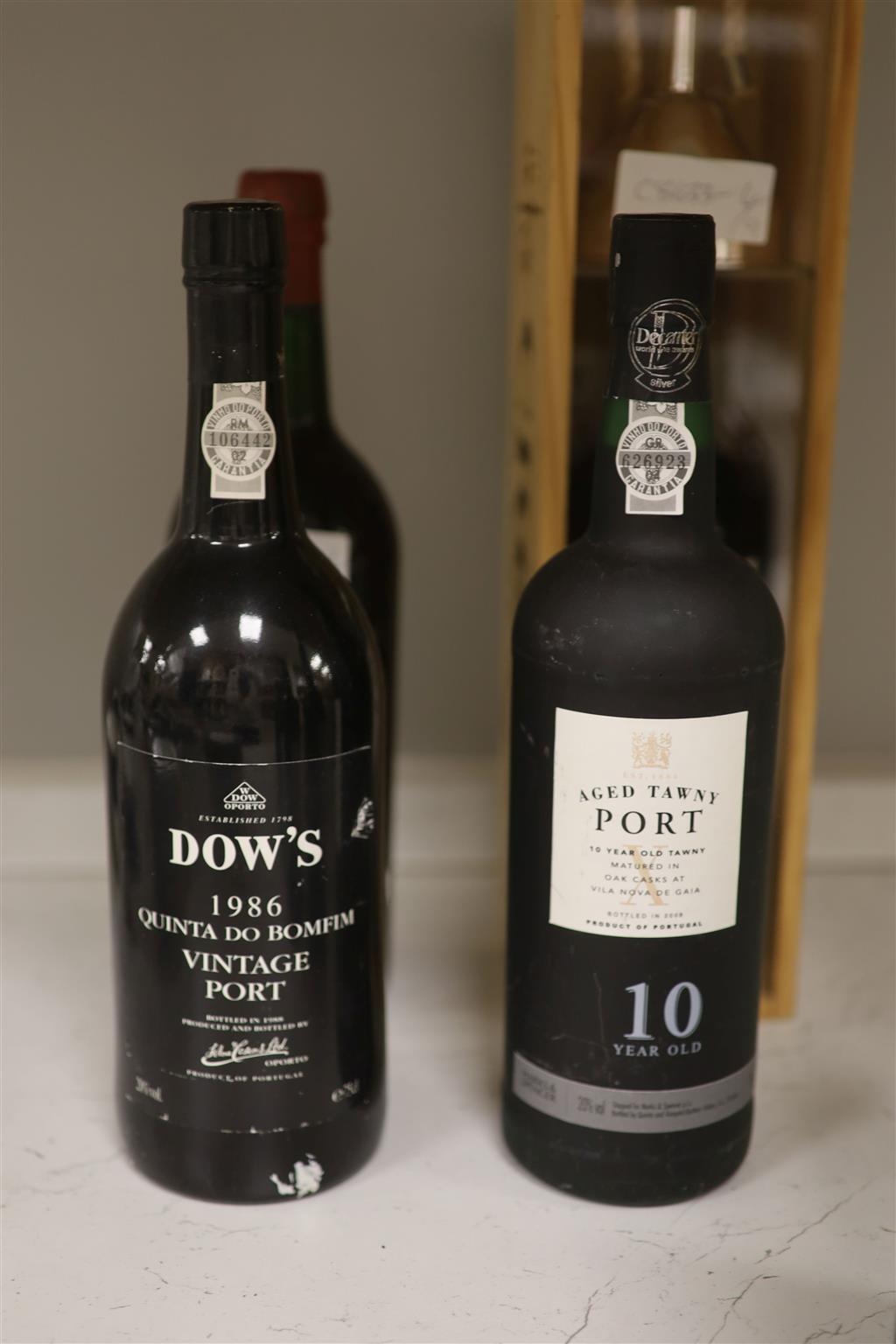 Nine assorted bottles of Port.